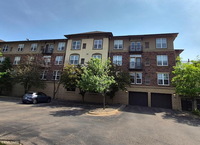 13560 Technology Dr Unit 1102, Eden Prairie, MN 55344 - view of apartment building / complex with a garage