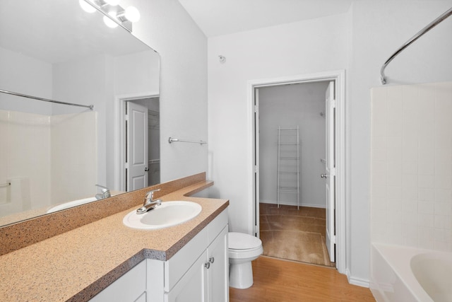 13560 Technology Dr Unit 1102, Eden Prairie, MN 55344 - full bath featuring toilet, wood finished floors, vanity, and tub / shower combination