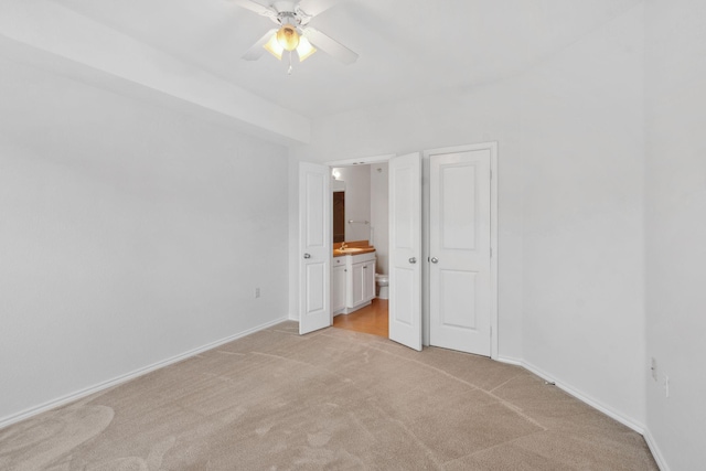13560 Technology Dr Unit 1102, Eden Prairie, MN 55344 - unfurnished bedroom with light carpet, ensuite bath, baseboards, and a ceiling fan