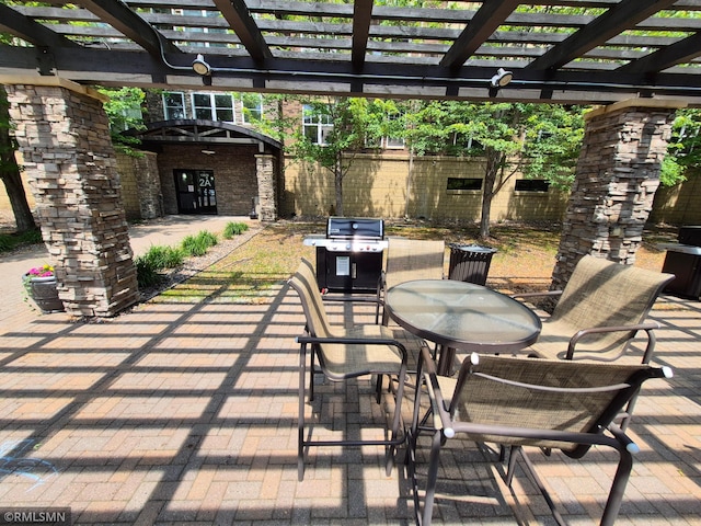 13560 Technology Dr Unit 1102, Eden Prairie, MN 55344 - view of patio / terrace with outdoor dining area, grilling area, and a pergola