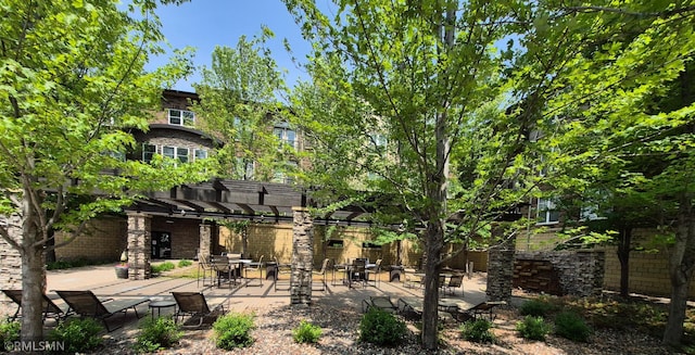13560 Technology Dr Unit 1102, Eden Prairie, MN 55344 - rear view of house with a patio, a pergola, and brick siding
