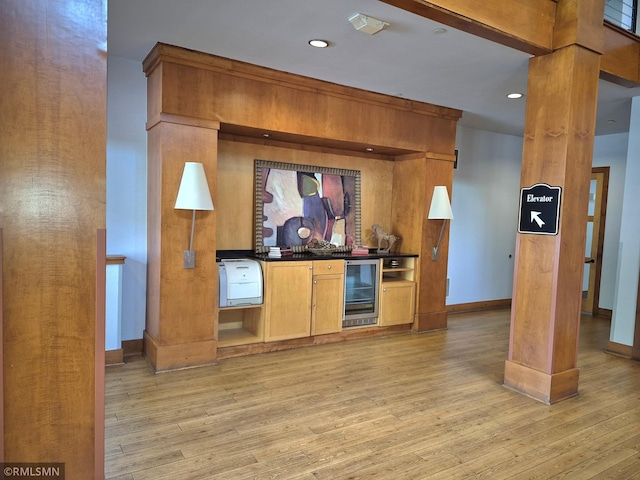 13560 Technology Dr Unit 1102, Eden Prairie, MN 55344 - bar area featuring wine cooler, light wood finished floors, baseboards, and recessed lighting