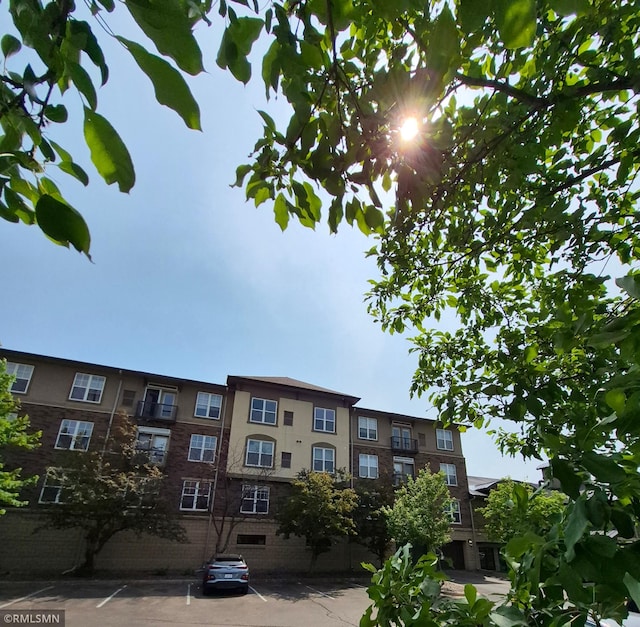 13560 Technology Dr Unit 1102, Eden Prairie, MN 55344 - view of building exterior featuring uncovered parking
