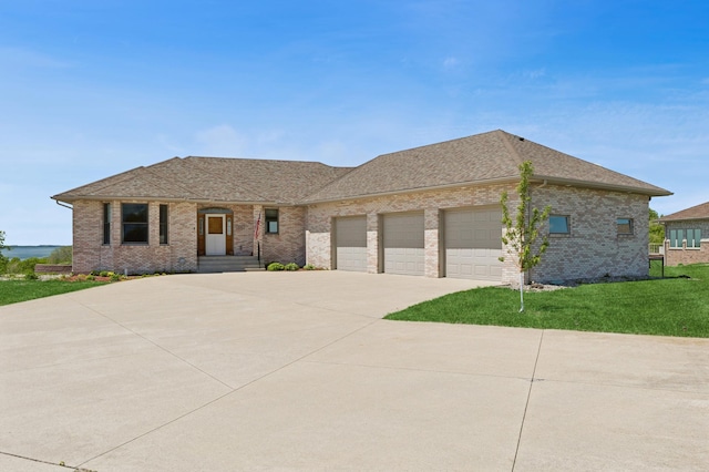 531 Depree Way, Glenwood, MN 56334 - view of front facade featuring concrete driveway, an attached garage, brick siding, and a front lawn