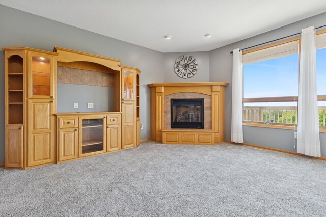 531 Depree Way, Glenwood, MN 56334 - unfurnished living room featuring carpet floors, a premium fireplace, and baseboards