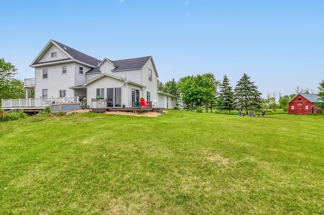 1782 225th St N, Hawley, MN 56549 - rear view of house with a deck and a yard