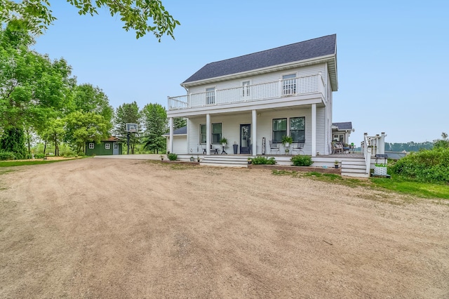 1782 225th St N, Hawley, MN 56549 - view of front of home with a balcony, covered porch, and dirt driveway