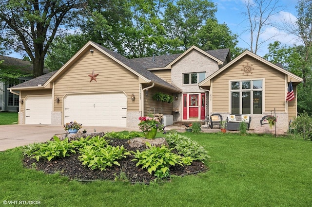 21857 Iden Avenue Pl N, Forest Lake, MN 55025 - view of front facade featuring brick siding, an attached garage, a front yard, concrete driveway, and a shingled roof