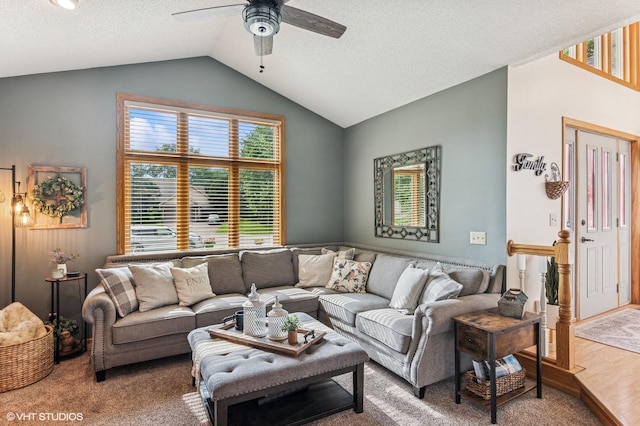 21857 Iden Avenue Pl N, Forest Lake, MN 55025 - carpeted living area with a ceiling fan, vaulted ceiling, and a textured ceiling