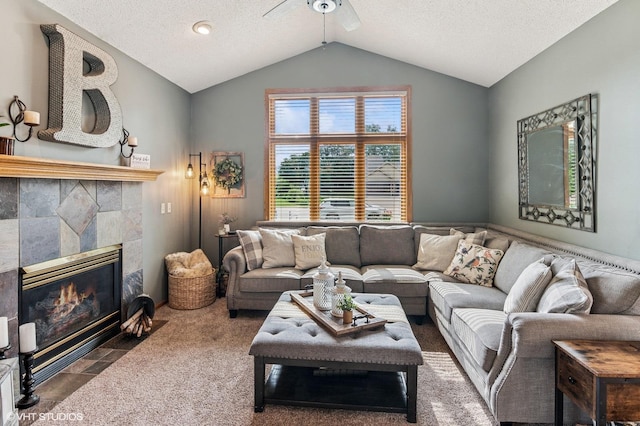 21857 Iden Avenue Pl N, Forest Lake, MN 55025 - living room with a ceiling fan, vaulted ceiling, a fireplace, a textured ceiling, and carpet