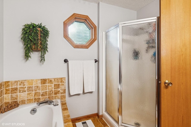 21857 Iden Avenue Pl N, Forest Lake, MN 55025 - bathroom featuring a shower stall, a garden tub, and a textured ceiling