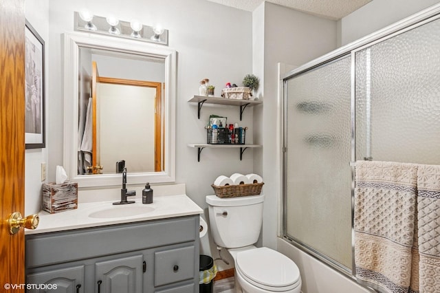 21857 Iden Avenue Pl N, Forest Lake, MN 55025 - bathroom featuring vanity, toilet, and bath / shower combo with glass door