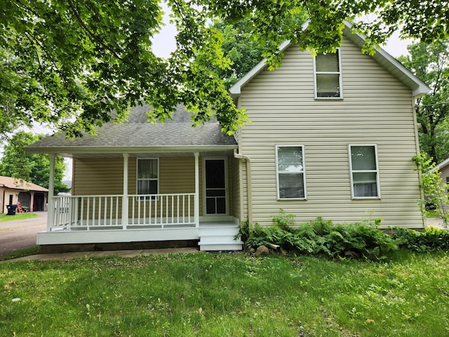 412 3rd St, Monticello, MN 55362 - view of front of property with covered porch and a front yard