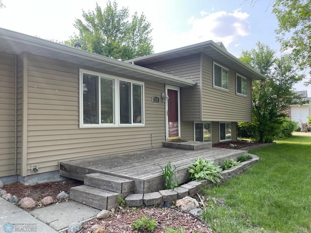 614 8th St E, West Fargo, ND 58078 - view of front of property featuring a front lawn and a deck