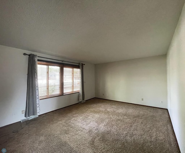 614 8th St E, West Fargo, ND 58078 - carpeted spare room featuring a textured ceiling