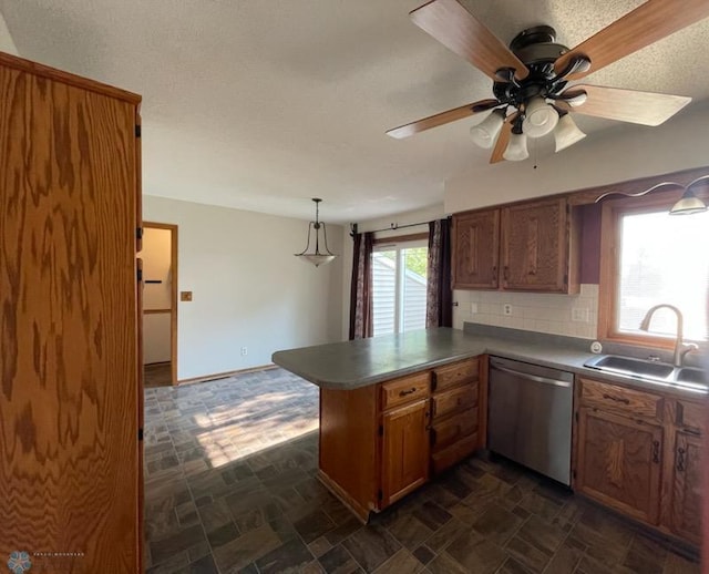 614 8th St E, West Fargo, ND 58078 - kitchen featuring dishwasher, a sink, ceiling fan, a peninsula, and decorative backsplash