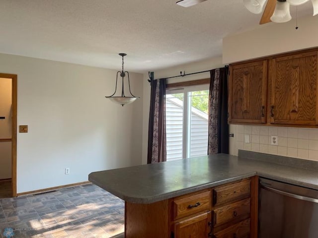 614 8th St E, West Fargo, ND 58078 - kitchen featuring stainless steel dishwasher, a peninsula, backsplash, and brown cabinets
