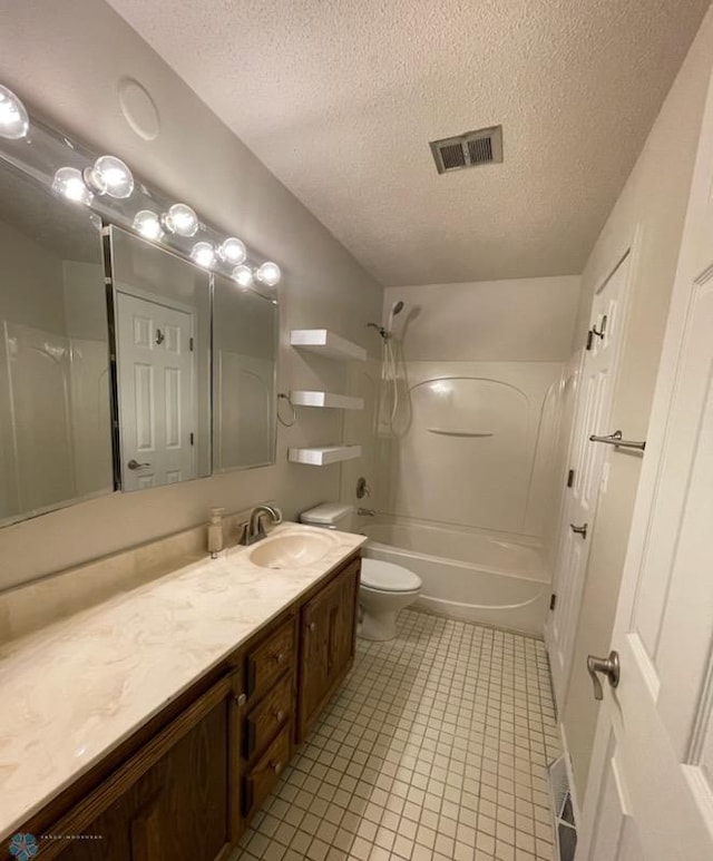 614 8th St E, West Fargo, ND 58078 - full bathroom with toilet, a textured ceiling, vanity, tile patterned floors, and tub / shower combination