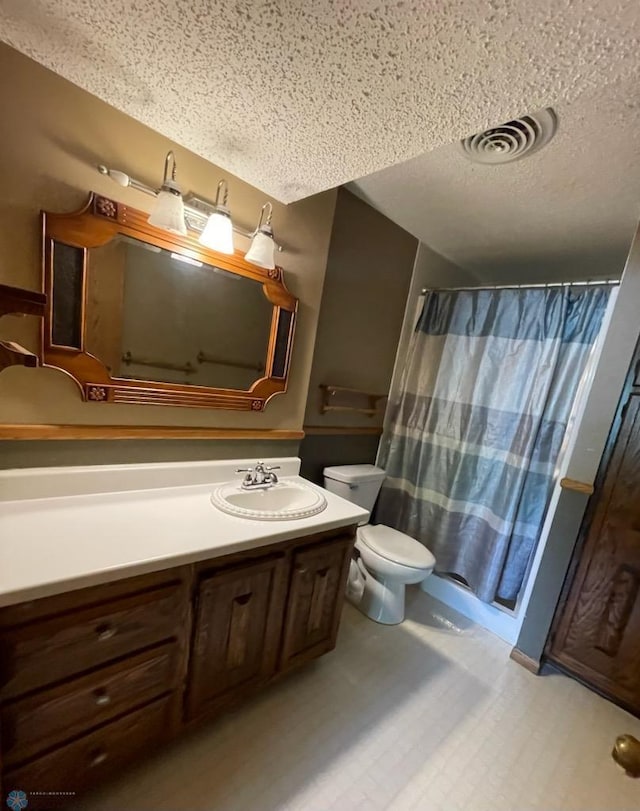 614 8th St E, West Fargo, ND 58078 - bathroom with toilet, vanity, a textured ceiling, and curtained shower