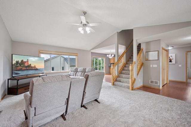 19470 Zumbro Ct NW, Elk River, MN 55330 - carpeted living room with stairway, lofted ceiling, a ceiling fan, baseboards, and a chandelier