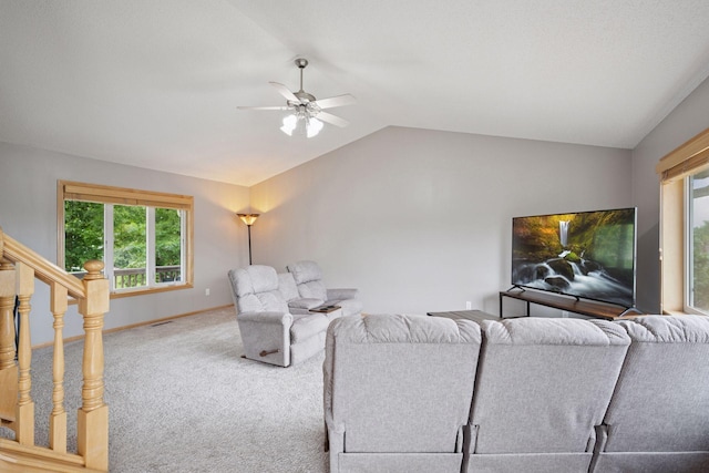 19470 Zumbro Ct NW, Elk River, MN 55330 - living area featuring lofted ceiling, carpet floors, ceiling fan, baseboards, and stairway