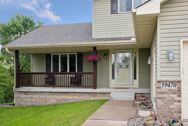 19470 Zumbro Ct NW, Elk River, MN 55330 - property entrance featuring a shingled roof and covered porch