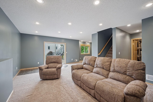 19470 Zumbro Ct NW, Elk River, MN 55330 - carpeted living room featuring stairs, baseboards, recessed lighting, and a textured ceiling