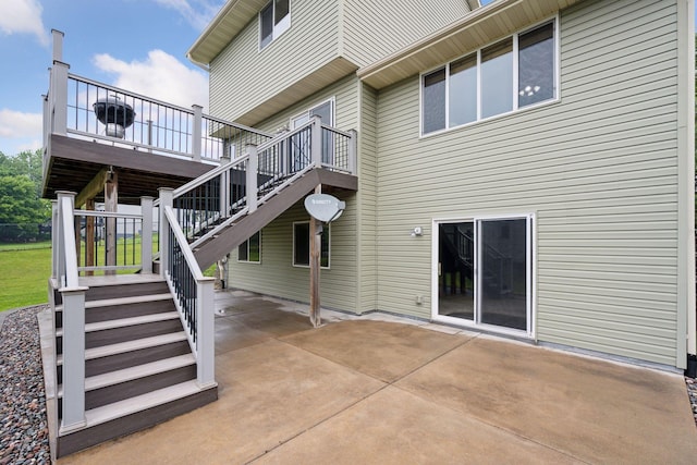 19470 Zumbro Ct NW, Elk River, MN 55330 - back of house featuring a patio area, stairs, and a wooden deck