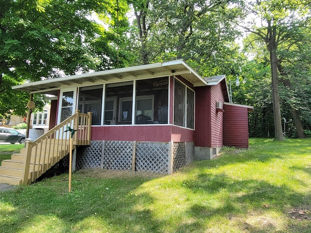 29501 Maplewood Rd Horseshoe, Unit Horseshoe, Callaway, MN 56521 - view of front of home with a sunroom and a front yard