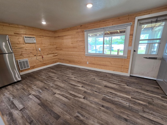 29501 Maplewood Rd Horseshoe, Unit Horseshoe, Callaway, MN 56521 - spare room featuring dark wood-style flooring, wooden walls, a wall mounted air conditioner, and recessed lighting