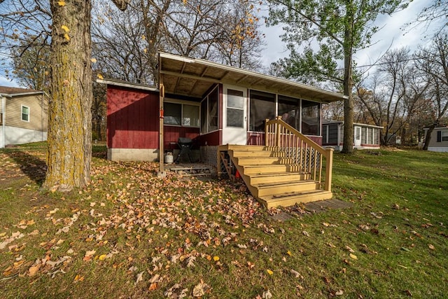 29501 Maplewood Rd Horseshoe, Unit Horseshoe, Callaway, MN 56521 - view of front of house with a sunroom and a front yard