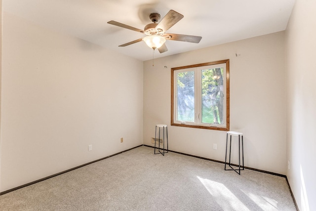 8563 72nd St S, Cottage Grove, MN 55016 - spare room with light colored carpet, ceiling fan, and baseboards