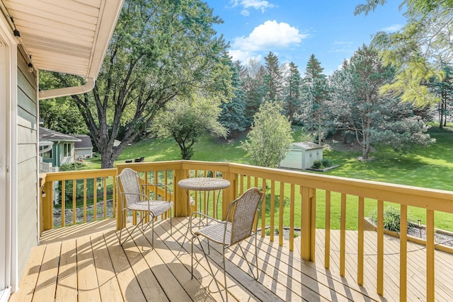 8563 72nd St S, Cottage Grove, MN 55016 - wooden terrace with a lawn and an outbuilding