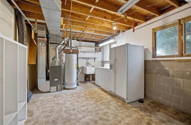8563 72nd St S, Cottage Grove, MN 55016 - basement with white fridge with ice dispenser, gas water heater, a sink, washer and clothes dryer, and heating unit