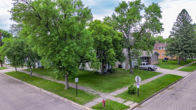 103 3rd St NE, Barnesville, MN 56514 - view of property hidden behind natural elements featuring driveway and a front lawn
