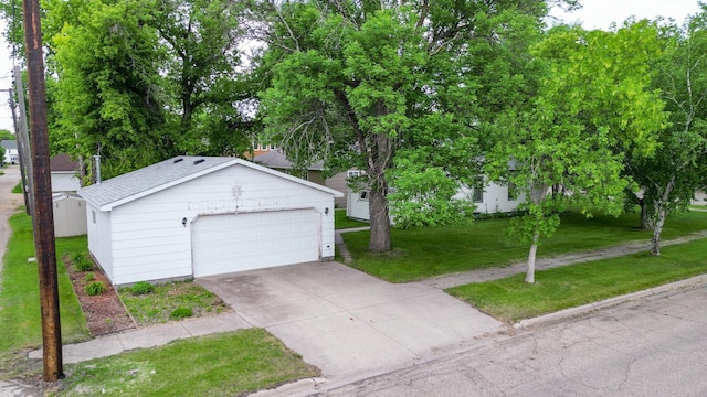 103 3rd St NE, Barnesville, MN 56514 - view of front of property with a front lawn, roof with shingles, and driveway