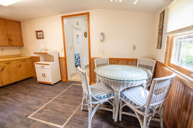 103 3rd St NE, Barnesville, MN 56514 - dining room featuring a wainscoted wall, dark wood-style flooring, and lofted ceiling