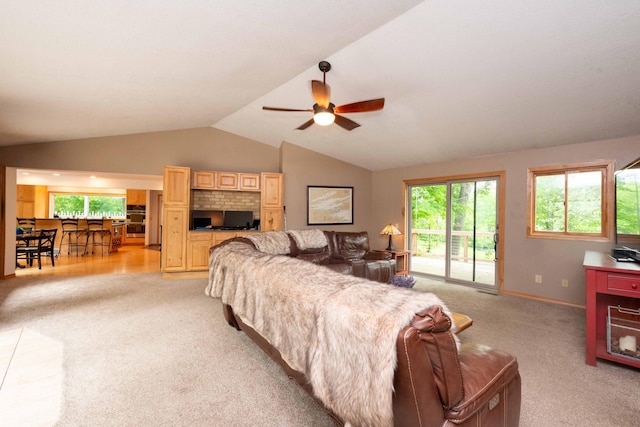 840 Shore Dr W, Orono, MN 55364 - living area featuring light colored carpet, vaulted ceiling, healthy amount of natural light, and a ceiling fan