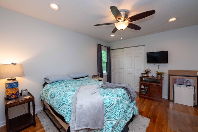 840 Shore Dr W, Orono, MN 55364 - bedroom with a closet, wood finished floors, baseboards, a ceiling fan, and recessed lighting