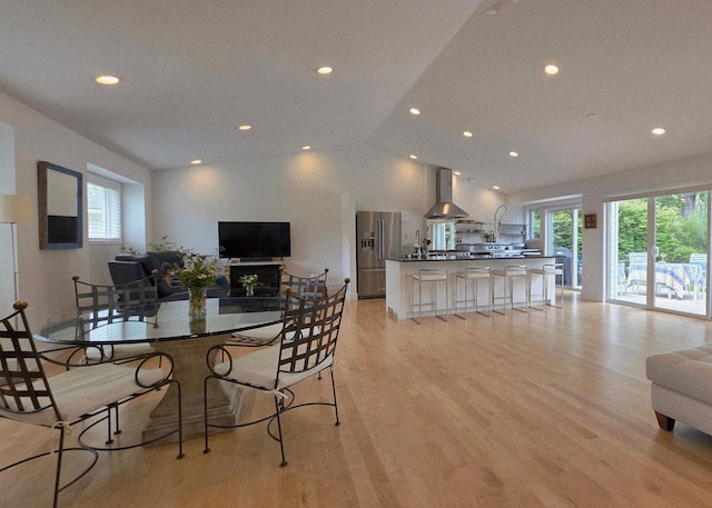 1300 Earle Way, Burnsville, MN 55306 - dining space featuring plenty of natural light, light wood-style flooring, vaulted ceiling, and recessed lighting
