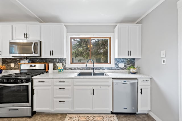 1252 Arkwright St, Saint Paul, MN 55130 - kitchen featuring appliances with stainless steel finishes, tasteful backsplash, light countertops, and white cabinets