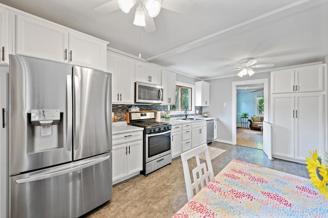 1252 Arkwright St, Saint Paul, MN 55130 - kitchen with appliances with stainless steel finishes, a ceiling fan, and white cabinetry