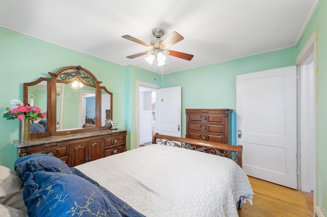 1252 Arkwright St, Saint Paul, MN 55130 - bedroom featuring light wood-style floors, ceiling fan, and ornamental molding