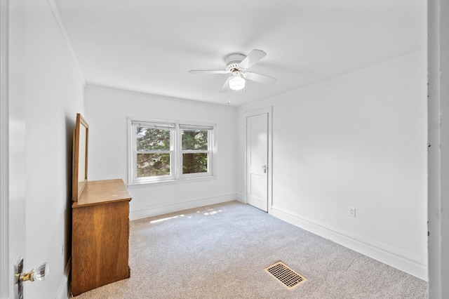 1252 Arkwright St, Saint Paul, MN 55130 - unfurnished room featuring a ceiling fan, carpet, and ornamental molding