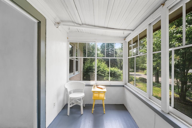 1252 Arkwright St, Saint Paul, MN 55130 - sunroom featuring wood finished floors and view of scattered trees