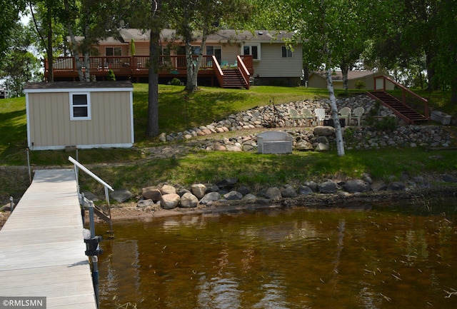 31145 409th Pl, Aitkin, MN 56431 - dock with stairway, a deck with water view, and a lawn