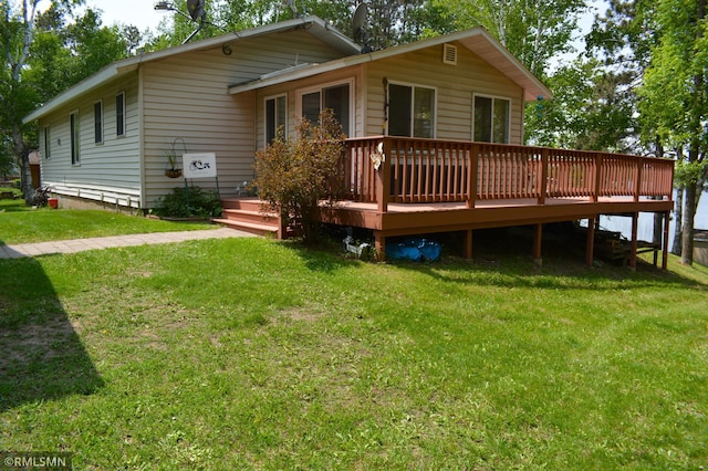 31145 409th Pl, Aitkin, MN 56431 - rear view of property with a deck and a yard