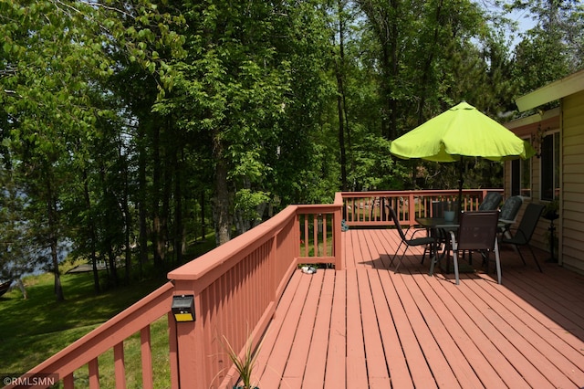 31145 409th Pl, Aitkin, MN 56431 - wooden deck with outdoor dining space and a yard