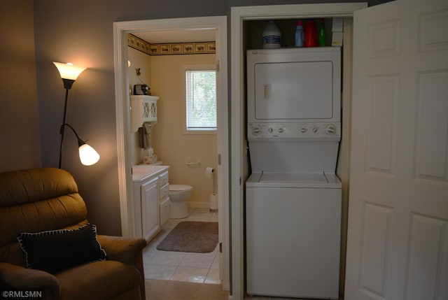 31145 409th Pl, Aitkin, MN 56431 - laundry area with stacked washer / dryer and light tile patterned floors