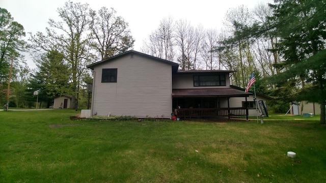 7047 Kingfisher Ln NE, Frohn Twp, MN 56601 - back of property with a yard and a porch
